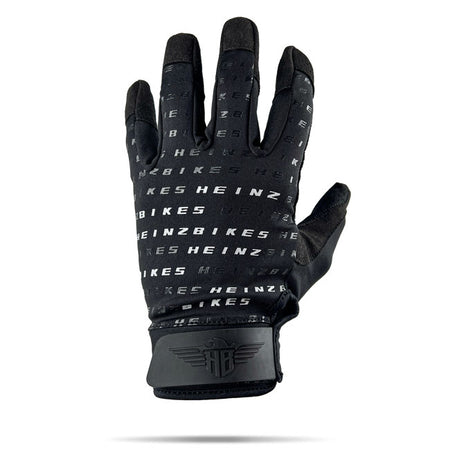The HeinzBikes Pattern gloves deliver more than just good looks. Built with breathable; durable materials; they keep your hands cool; dry; and ready for the ride. Enjoy max comfort with 4-way stretch fabric; vibration-dampening padding; and reinforced palms for solid grip. Stay connected with touchscreen-friendly synthetic leather and get them on in seconds with the pull-on loop. The Pattern gloves are built to ride; designed to stand out.