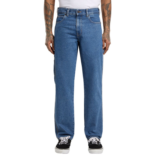 The Dickies 1993 Regular tapered carpenter jeans are a regular fit; tapered leg denim jeans. Made out of a 14oz slub cotton denim for comfort and durability; features include slanted front pockets; zip fly and shank button closure; patched back pockets with woven Dickies label; hammer loop; and ruler and tool pocket. Durable and ready to move; these are an anywhere and everywhere carpenter jeans. Regular fit with tapered leg 100% cotton