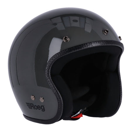 The Roeg JETT helmet; a modern classic that stays true to its roots as the trendsetter in headgear. Crafted for those who value a lightweight; open-face design without compromising style; the JETT is anything but ordinary. This helmet effortlessly blends urban chic with practicality; ready to accompany you on spontaneous rides or impromptu meet-ups. With its ''RQ LIGHT'' fiberglass shell; multi-density EPS liner; and four shell sizes; the JETT ensures a snug fit. The classic double D-ring adjustable chinstr