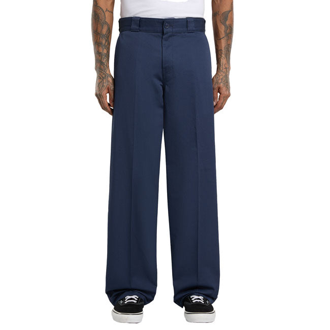 The Dickies 247 Loose work pant is a loose fit; straight leg twill work pant. Made with 8.3OZ 100% cotton with enzyme wash for softening. Featuring work pant welt back pockets; front slash pockets; front and back crease; zip-fly with top button closure; and contrast waistband tape and print. A modern take on classic workwear. Available in a wide range of classic and seasonal fade resistant colors. Loose fit with straight leg 100% cotton twill