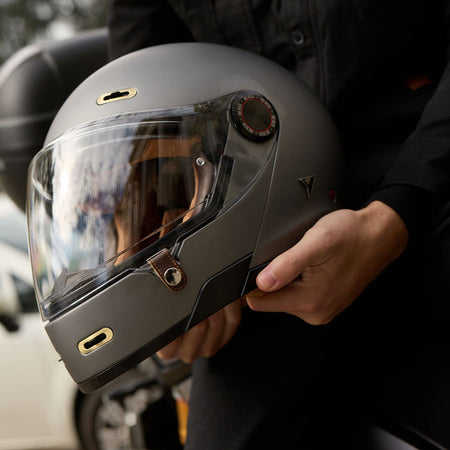 The By City 90 Degrees helmet is the ultimate modular helmet for taking it all on the road in the most stylish way possible. Crafted with a lightweight fiberglass shell and multi-density padding; it ensures optimal protection and comfort for riders. The injected visor provides clear visibility; while ventilation inlets maintain airflow during rides. Its removable and washable interior ensures hygiene and longevity. Equipped with a micrometric closure for secure fastening; the helmet is also Bluetooth-ready;