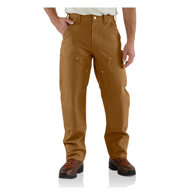 LOOSE FIT; STRAIGHT LEG ú 12 oz/ydý - 407 gsm ú 100% Cotton ú Firm duck ú Sits at the waist ú Long Trousers ú Two front slant pockets with extra hidden coin pocket in right front ú Left-leg hammer loop ú Two fully lined back patch pockets ú Double front panels for durability with bottom entry knee pad pockets ú Right leg back utility pocket for easy storage of ruler or welding rods; left leg back tool pocket ú Folded single stitched clean finished hem ú Triple stitched main seams ú Carhartt la