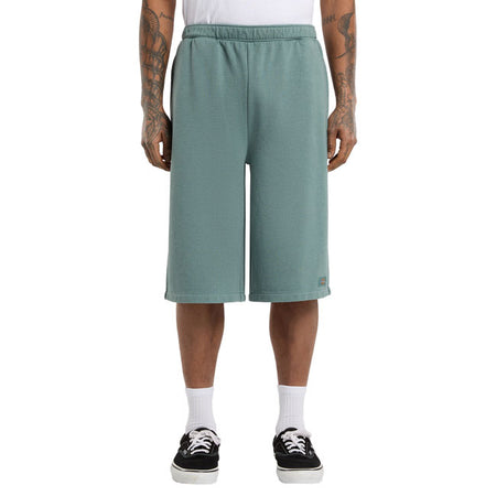 The Dickies Streetsboro 13 Inch sweat short is a loose fitting with slight A-line athletic shorts. Made out of garment dyed ring spun french terry poly-cotton; theseshorts feature elasticated waist; angled front pockets; back welt pocket; and dyed to-match labels above hem and on back pocket. The perfect active shorts for the warmer seasons. Loose fit 60% cotton / 40% polyester