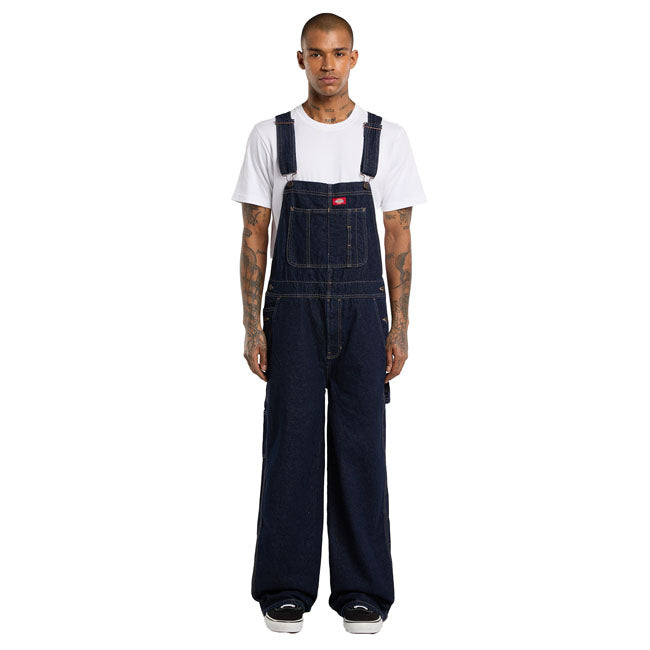 The Dickies Loose Denim Bib is a loose fit; straight leg denim bib. Made out of 14oz slub cotton denim; this bib features slanted front pockets; coin pocket;multi-tool chest pocket; zip fly; side button closure; patched back pockets; hammer loop; ruler and tool pocket; and woven Dickies labels on front above chest pocket and on back patch pocket. A work ready bib with movement and comfort built in. Available in several colors for men and female. Loose fit 100% cotton