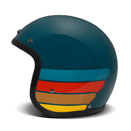 Embrace the fusion of classic style and modern functionality with the DMD Retro helmet; a nod to the iconic 70''s design. This helmet isn''t just a protective gear but a statement piece; crafted for those who dare to stand out. With its ECE 22.06 approved fiberglass shell available in three sizes; it offers a snug fit. The helmet is bluetooth ready; features integrated snaps for visors; and boasts a luxurious; washable lining with Velcro for a custom fit. Secured with a padded chin strap and a reliable Doub