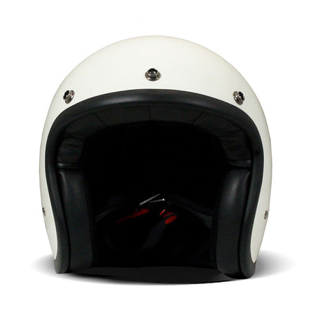 Embrace the fusion of classic style and modern functionality with the DMD Retro helmet; a nod to the iconic 70''s design. This helmet isn''t just a protective gear but a statement piece; crafted for those who dare to stand out. With its ECE 22.06 approved fiberglass shell available in three sizes; it offers a snug fit. The helmet is bluetooth ready; features integrated snaps for visors; and boasts a luxurious; washable lining with Velcro for a custom fit. Secured with a padded chin strap and a reliable Doub