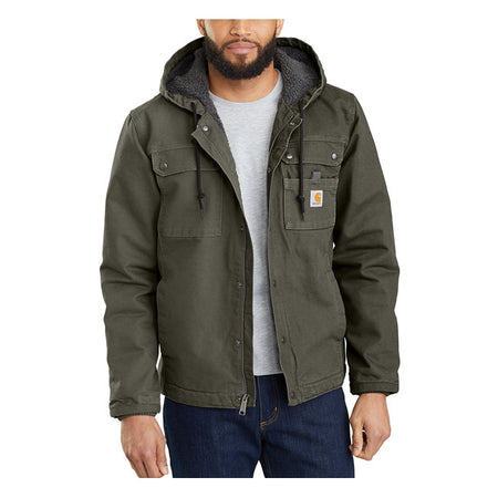 This Carhartt jacket is built to endure cold; wind and tough days on the job. Rugged without being rigid; made with durable cotton duck. This warm layer is lined with soft sherpa fleece through the body and hood; with warm quilted nylon through the sleeves. Relaxed Fit Wind FighterT Wind resistant Attached three-piece hood with low profile adjustment at hood hem Two chest pockets with flaps and snap closure Two lower front pockets Two interior pockets; one pocket with zipper closure and one with hook-