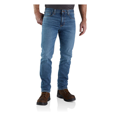 STRAIGHT FIT; TAPERED LEG ú 11.25 oz/ydý - 381 gsm ú 85% Cotton/14% Polyester/1% Elastane ú Rugged FlexT Denim ú Rugged FlexT - Eases movement ú Sits slightly below the waist ú Long Trousers ú Two front pockets ú Coin pocket in right front pocket ú Two reinforced back pockets ú Triple stitched main seams ú Stronger sewn-on-seam belt loops ú Carhartt label sewn on pocket