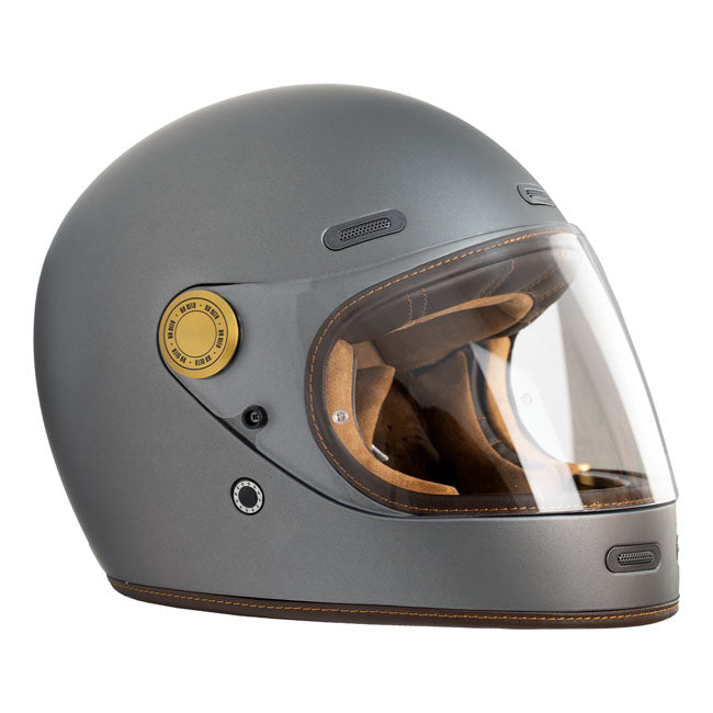 The By City Roadster III helmet blends timeless design with advanced safety. Crafted from fiberglass; it offers durability and a lightweight feel. The leather-finished; removable; and washable multi-density padding ensures maximum comfort; while ventilation inlets and a rear fastening system provide added functionality. The injected visor; anti-fog ready with by laminate; guarantees clear vision in any weather. A double buckle closure ensures a secure fit; and it's Bluetooth system ready for seamless connec