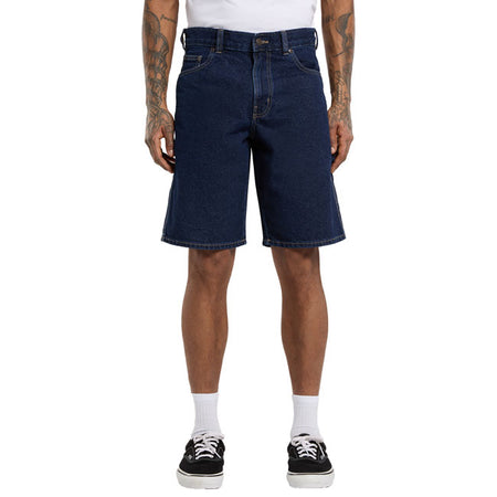 The Dickies 1993 11 Inch carpenter short jeans are a regular fit; straight legged denim carpenter short. Made out of 14oz slub cotton denim twill for durabilty and comfort; features include rounded front pockets; zip fly and shank button closure; patched back pockets; hammer loop; ruler and tool pocket; and woven Dickies label on back patch pocket. Durable; comfortable; and rooted in quality denim fabrication and construction. Regular fit 100% cotton