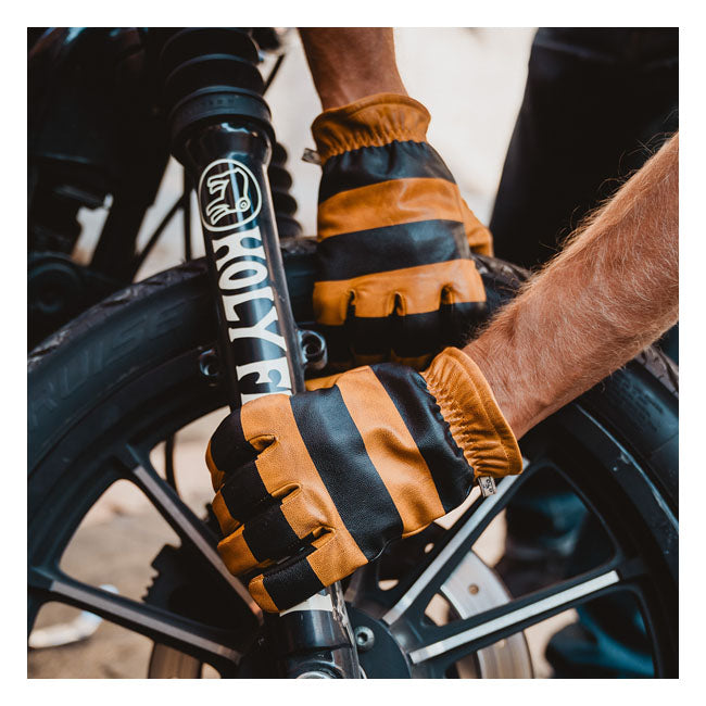 The Holy Freedom Pitt gloves are a nice cafe racer style glove with improved fitting; padded comfort liner; elastic wrist with a printed internal lining. It is made from full grain vintage waxed leather. The classic striped printed worker gloves with the cool looks.