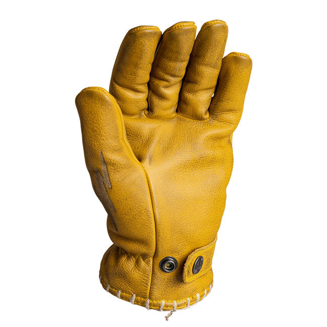 The John Doe Coyote Glove comes handcrafted from the best cowhide. Each glove is treated with a purely plant-based balm after stitching. This gives you a unique item that grows in character every time you wear it. Each preformed glove is ergonomically designed to match the human hand for an even better wearing experience. The cuffs are adjustable with press studs. Details such as the stitched seam on the cuff and various appliques on the fingers and back of the glove give each glove its unique style. CE ce