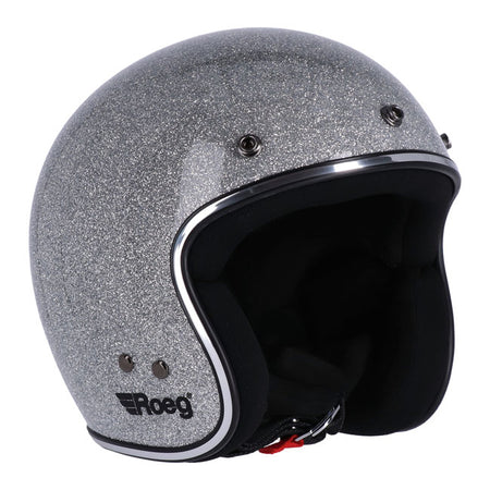The Roeg JETT helmet; a modern classic that stays true to its roots as the trendsetter in headgear. Crafted for those who value a lightweight; open-face design without compromising style; the JETT is anything but ordinary. This helmet effortlessly blends urban chic with practicality; ready to accompany you on spontaneous rides or impromptu meet-ups. With its ''RQ LIGHT'' fiberglass shell; multi-density EPS liner; and four shell sizes; the JETT ensures a snug fit. The classic double D-ring adjustable chinstr