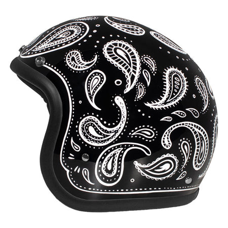 Embrace the fusion of classic style and modern functionality with the DMD Retro helmet; a nod to the iconic 70''s design. This helmet isn''t just a protective gear but a statement piece; crafted for those who dare to stand out. With its ECE 22.06 approved fiberglass shell available in three sizes; it offers a snug fit. The helmet is bluetooth ready; features integrated snaps for visors; and boasts a luxurious; washable lining with Velcro for a custom fit. Secured with a padded chin strap and a reliable Doub