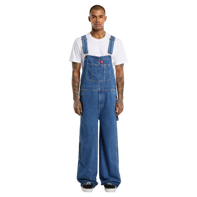The Dickies Loose Denim Bib is a loose fit; straight leg denim bib. Made out of 14oz slub cotton denim; this bib features slanted front pockets; coin pocket;multi-tool chest pocket; zip fly; side button closure; patched back pockets; hammer loop; ruler and tool pocket; and woven Dickies labels on front above chest pocket and on back patch pocket. A work ready bib with movement and comfort built in. Available in several colors for men and female. Loose fit 100% cotton