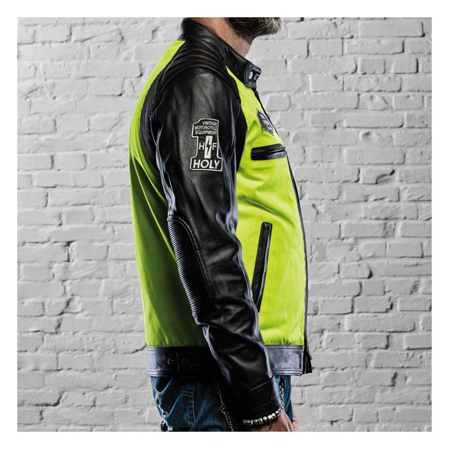 CE approved jacket with high visibility to guarantee safety on the road. Classic design with 7 pockets (4 external and 3 internal) and completely water repellent. The inner lining consists of 100% black silk. Features universal pockets for inserting back protectors; shoulder and elbow protectors.