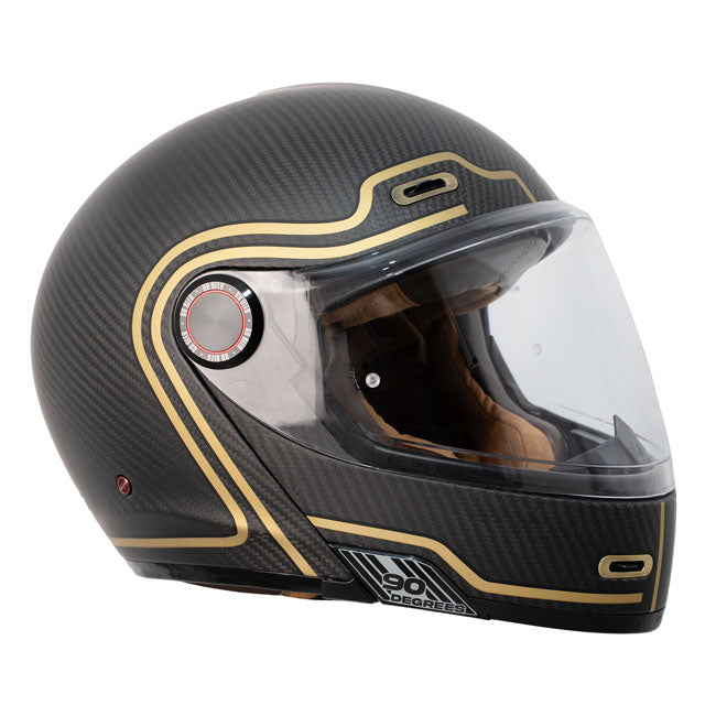 The By City 90 Degrees helmet is the ultimate modular helmet for taking it all on the road in the most stylish way possible. Crafted with a carbon shell and multi-density padding; it ensures optimal protection and comfort for riders. The injected visor provides clear visibility; while ventilation inlets maintain airflow during rides. Its removable and washable interior ensures hygiene and longevity. Equipped with a micrometric closure for secure fastening; the helmet is also Bluetooth-ready; catering to mod