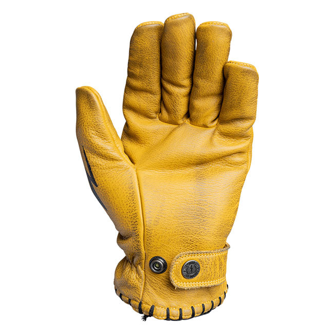 The John Doe Coyote Glove comes handcrafted from the best cowhide. Each glove is treated with a purely plant-based balm after stitching. This gives you a unique item that grows in character every time you wear it. Each preformed glove is ergonomically designed to match the human hand for an even better wearing experience. The cuffs are adjustable with press studs. Details such as the stitched seam on the cuff and various appliques on the fingers and back of the glove give each glove its unique style. CE ce